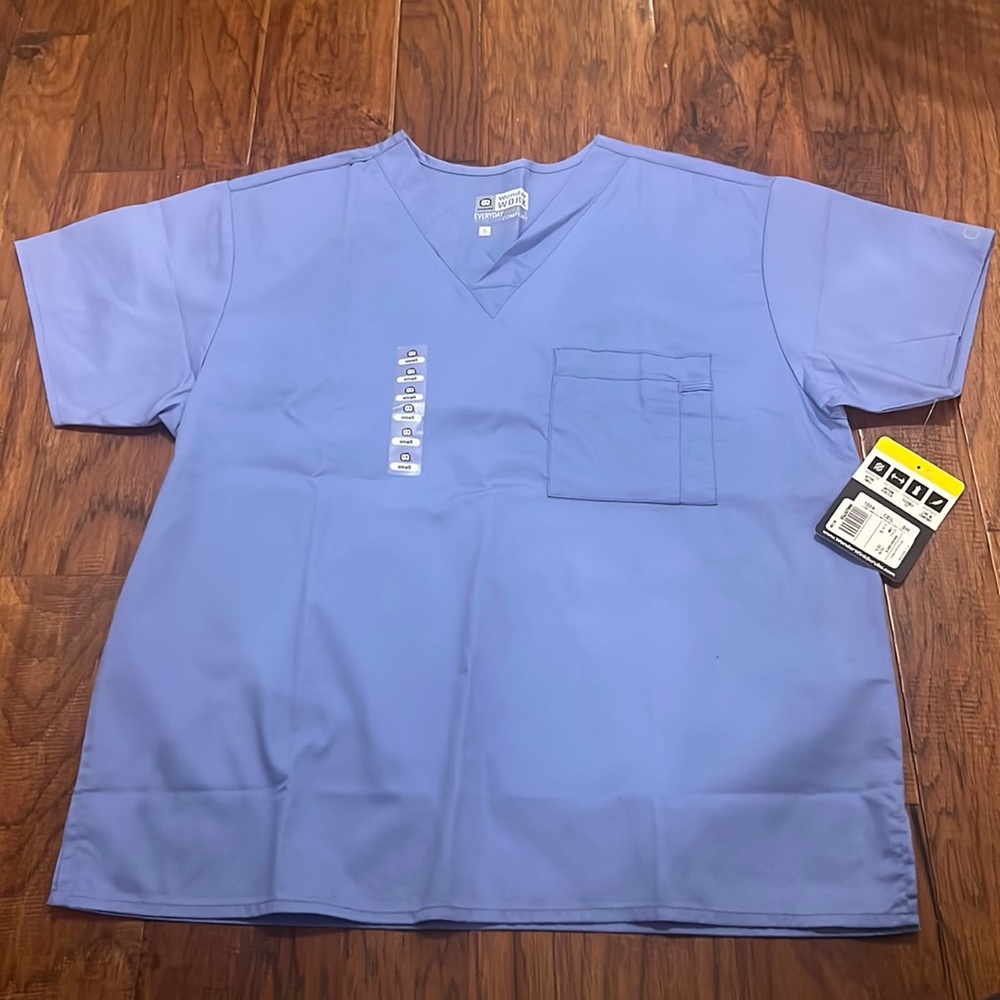Unisex WonderWork Ceil blue scrub top. Size S